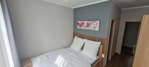 Postel nebo postele na pokoji v ubytování KL Apartments