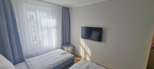 Postel nebo postele na pokoji v ubytování KL Apartments