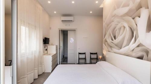 A bed or beds in a room at Casa vacanza il Gelsomino Magico