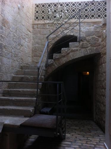 a staircase in a building with a stair case at Al-Hakim Boutique Hotel Old Town Nazareth in Nazareth
