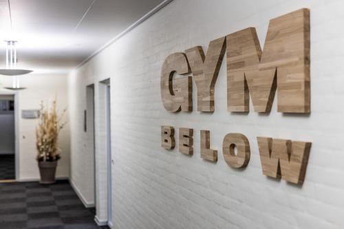 a sign for a gym ballroom on a wall at The Lodge Billund in Billund
