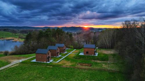 an aerial view of a group of buildings on a field at Domek Dzikie Lisko in Lesko