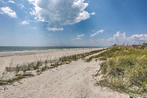 a sandy beach with a view of the ocean at Pet-Friendly - Luxe 3BR Golf Villa - 5 Mins to Beach - Sleeps 8 in Myrtle Beach