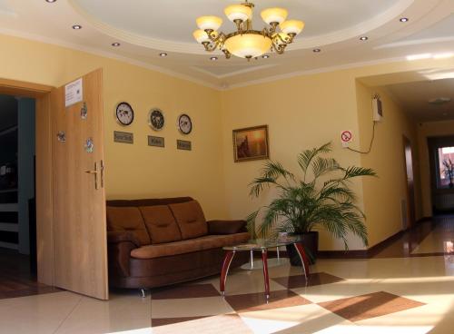 a living room with a couch and a table at Zakarpatskiy Oazis in Karpaty