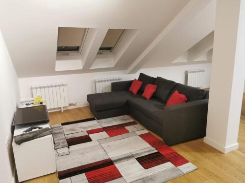 a living room with a couch and a rug at Zemun blue star in Zemun