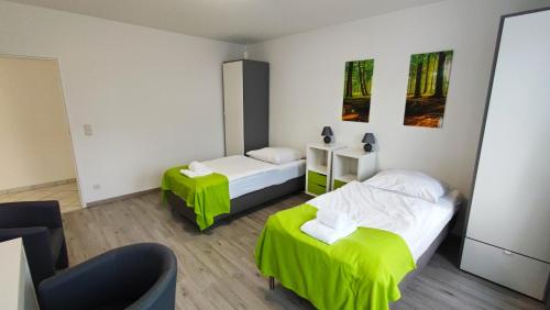 מיטה או מיטות בחדר ב-Zimmervermietung38 - Wild 2
