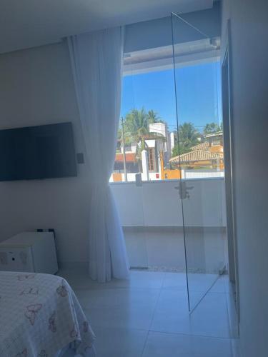 Postel nebo postele na pokoji v ubytování Casa 4 suítes com piscina Condomínio Lagoa Dourada Ilha de Itaparica BA