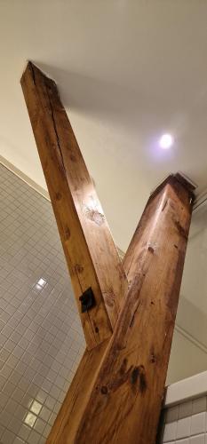 a piece of wood hanging from the ceiling at Vertshuset Røros in Røros