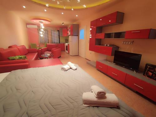 Ένα ή περισσότερα κρεβάτια σε δωμάτιο στο Gogo Apartments