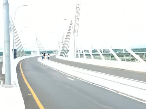 a bridge with two people walking on it at Shalakwe Hills-Inn Guesthouse Kasane in Kasane