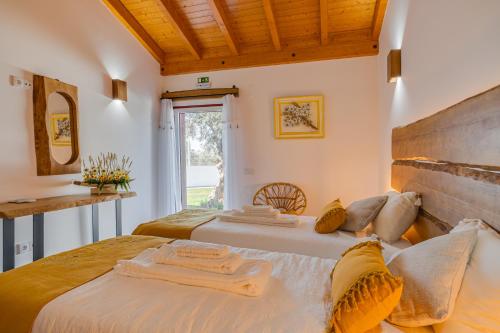 Säng eller sängar i ett rum på Monte Da Raposeira