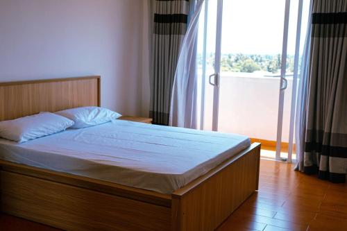 Ένα ή περισσότερα κρεβάτια σε δωμάτιο στο Aeonsky apartment Negombo beach and airport