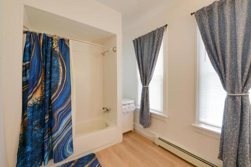 a bathroom with two windows and a bath tub at Pet-Friendly Vacation Rental in Atlantic City! in Atlantic City