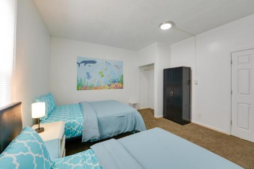 a bedroom with two beds and a dresser at Pet-Friendly Vacation Rental in Atlantic City! in Atlantic City