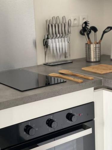 a kitchen with a counter top with a stove at Résidence blue dream in Les Trois-Îlets