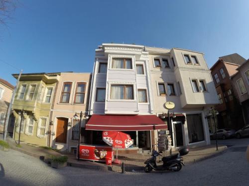 a house with a scooter parked in front of it at Meydan Suites in Istanbul