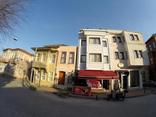 a building with a scooter parked in front of it at Meydan Suites in Istanbul