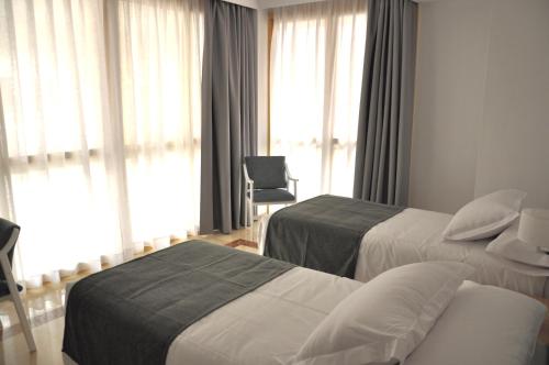 Ένα ή περισσότερα κρεβάτια σε δωμάτιο στο NEO HOTEL