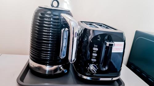 a coffee maker sitting on top of a counter at Mimi's Private Compact and Cozy Ensuite in Netherton