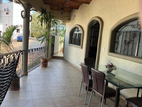 a patio with a table and chairs on a house at Casita tranquila in Sayulita