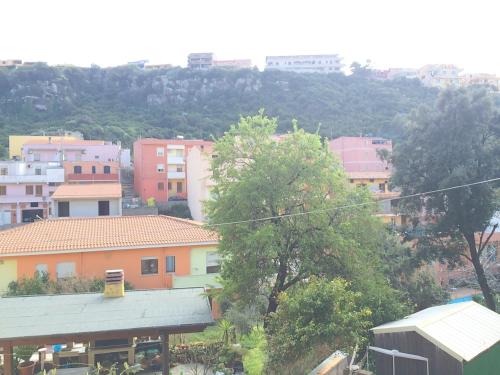 a view of a city with buildings and trees at B&B Fontevecchia in Castelsardo