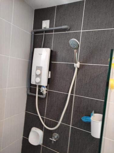 a shower in a bathroom with a blow dryer at 7INN Evo Soho Bangi (Free Parking, WIFI, Netflix) in Bandar Baru Bangi