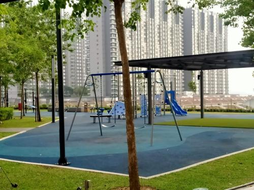 a playground in a park with a swing at Cozy Southville Bangi Free parking Wifi Netflix in Bangi
