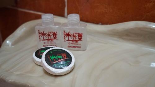 a plastic tray with two bottles of toothpaste at Choby's House Holbox in Holbox Island