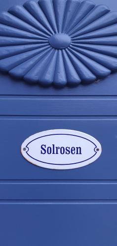a close up of a blue object with a logo on it at Windalens på Österlen in Tomelilla