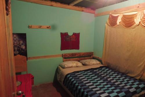Giường trong phòng chung tại Casa Deja-vu