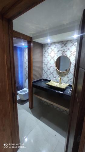 a bathroom with a sink and a toilet at Villa à bahia golf beach in Kasba Bou Hamira