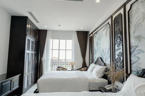 Postel nebo postele na pokoji v ubytování Royal Boutique Hotel Phu Quoc Island