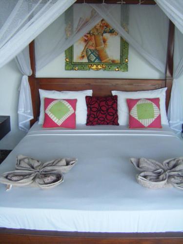 Кровать или кровати в номере Alur Beach Homestay
