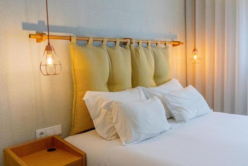 Ένα ή περισσότερα κρεβάτια σε δωμάτιο στο The Rex Hotel Porto
