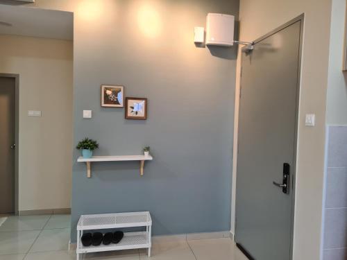 a bathroom with a shower and a table on a wall at Alpine Parkland Netflix 5 beds at MRT Batu 11 Cheras in Cheras