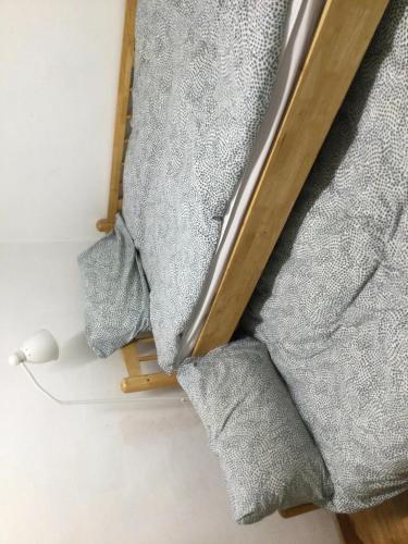 a pile of towels on the floor in a room at Hostel Metro in Seoul