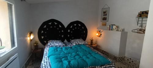 Ένα ή περισσότερα κρεβάτια σε δωμάτιο στο maison MON REVE
