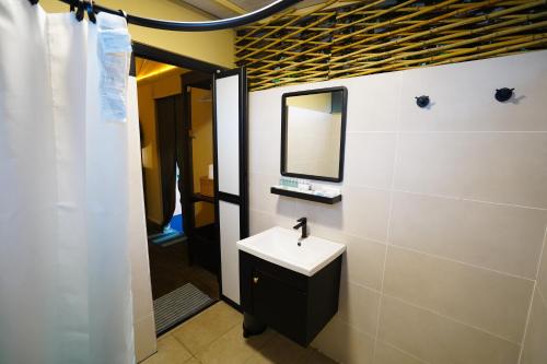 a bathroom with a sink and a mirror at SUNWAY LAGOON SDN BHD in Subang Jaya