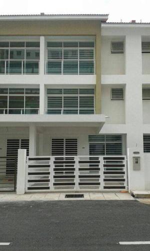 a white building with a fence in front of it at Penang holiday villa in Jelutong