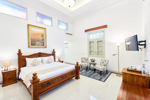 Postel nebo postele na pokoji v ubytování Tirtodipuran Hotel by Natts Hospitality Indonesia