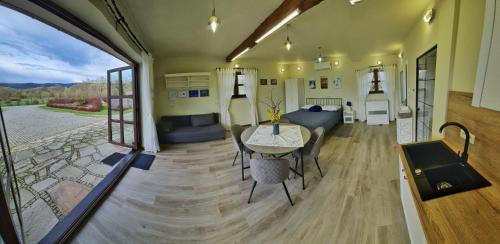 a living room and dining room of a tiny house at W dolinie Sanu in Lesko