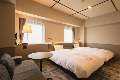 Katil atau katil-katil dalam bilik di SK HOTEL Kobe Ekimae