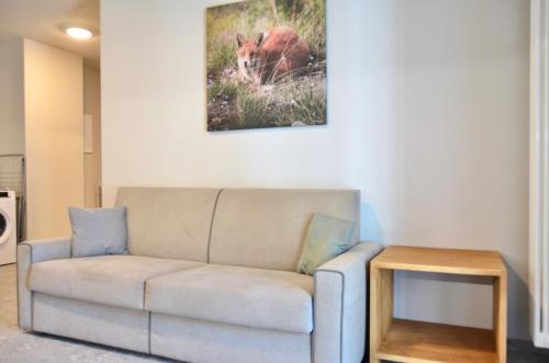a living room with a couch and a table at Case Verdi in Bardonecchia