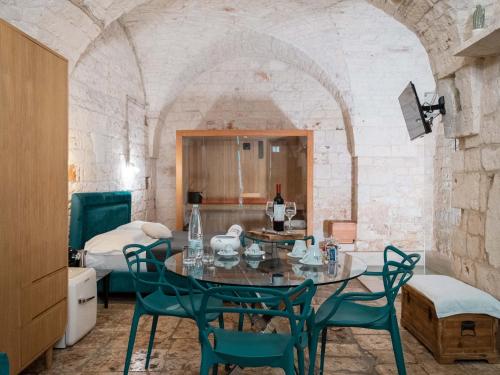 a dining room with a table and chairs at Dama Bianca Boutique Hotel Ostuni in Ostuni