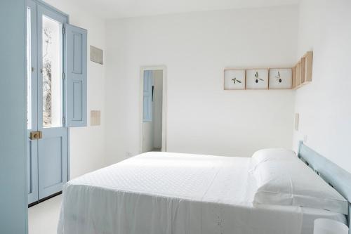 Letto o letti in una camera di Masseria Berzario