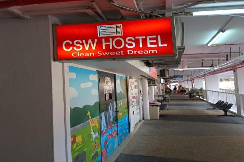 a sign for a cwx hospital clean sweet dream at CSW Hostel in Singapore