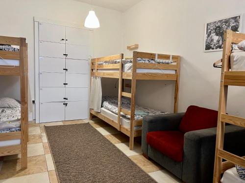 a living room with a couch and bunk beds at GRAN hostel in Banská Bystrica