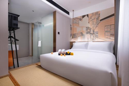 From K Huan Kai Hotel -Changsha Wuyi Plaza IFS Branchにあるベッド
