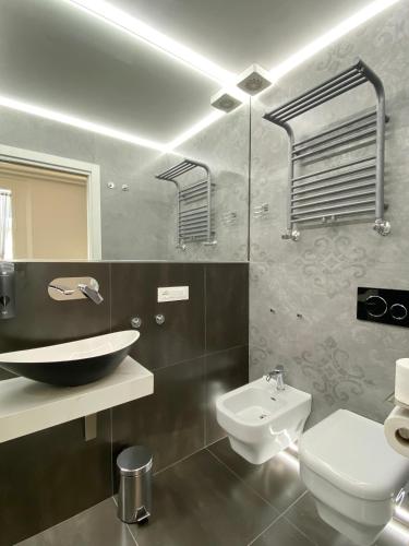 a bathroom with a sink and a toilet at Casa Granatelli in Palermo