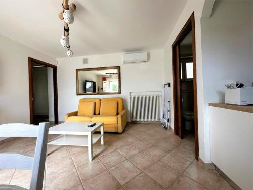 a living room with a couch and a table at Maison dei Trulli in Locorotondo